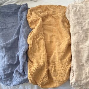 Three Mushie Muslin bassinet sheets EUC. Fall Yellow, Tradewinds, Fog.